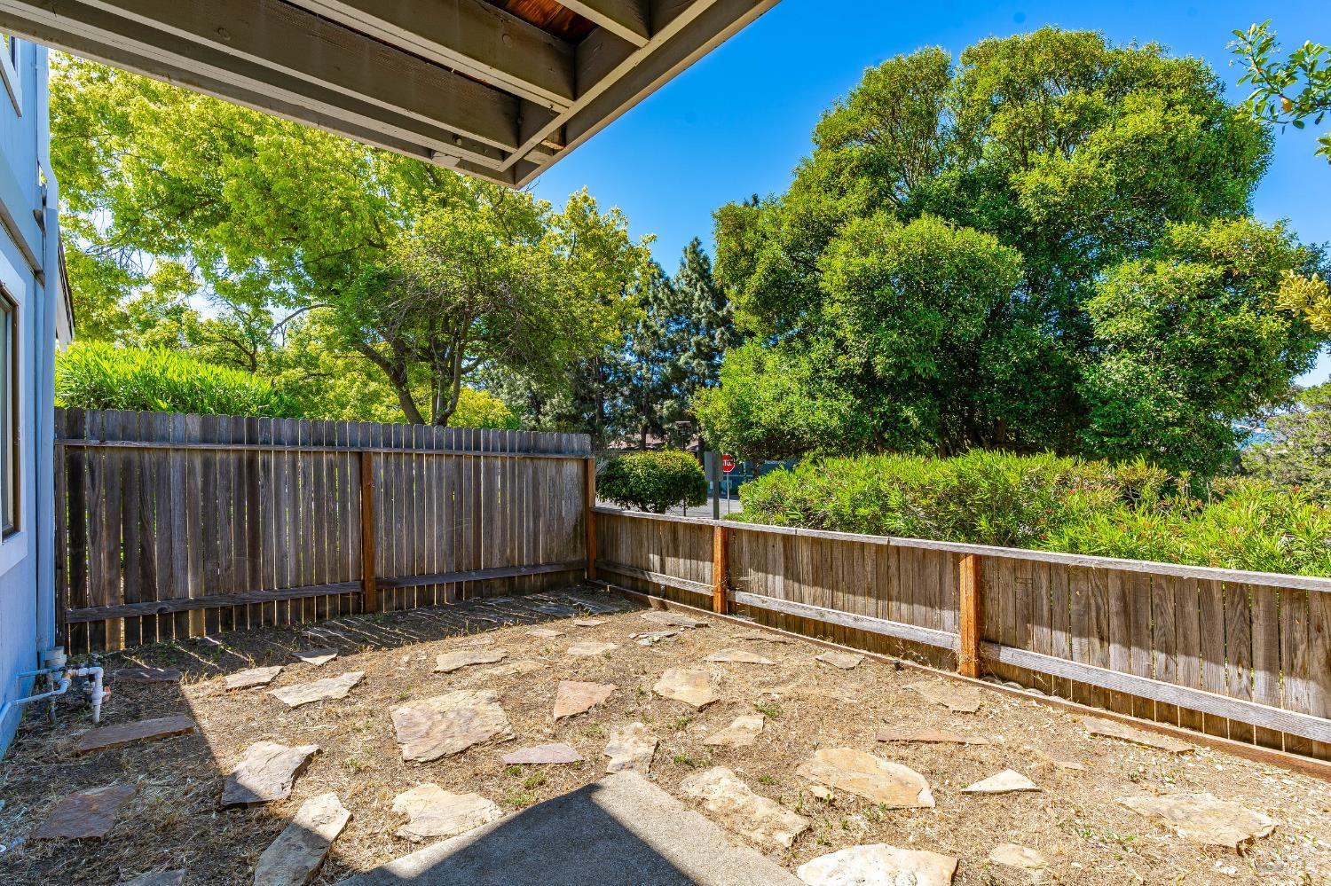 2000 Clearview Circle Benicia, CA 94510 - Photo 25 of 33 a view of a backyard with wooden fence and a bench