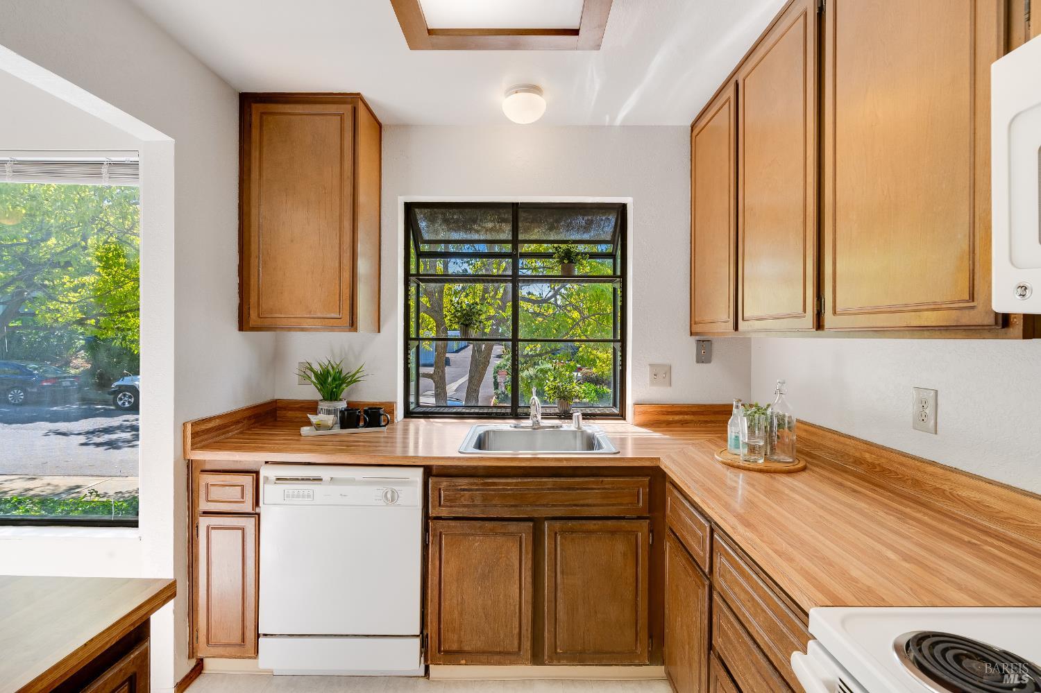 2000 Clearview Circle Benicia, CA 94510 - Photo 9 of 33 a kitchen with stainless steel appliances a sink a stove and a window