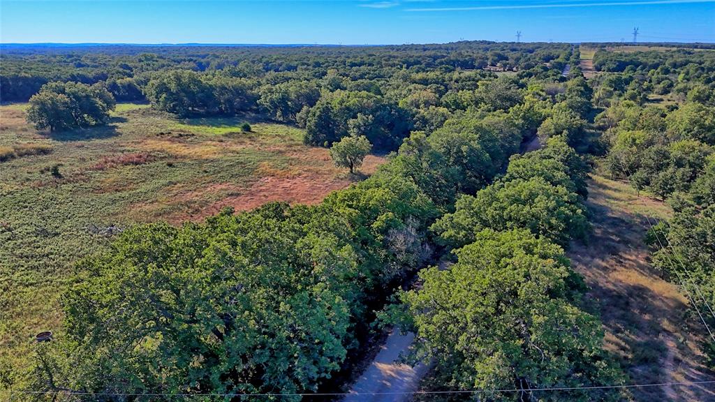 4 4 Wire Road Bowie, TX 76230 - Photo 3 of 39 a view of a dry yard with green space