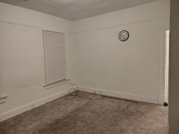 a view of a hallway to rooms