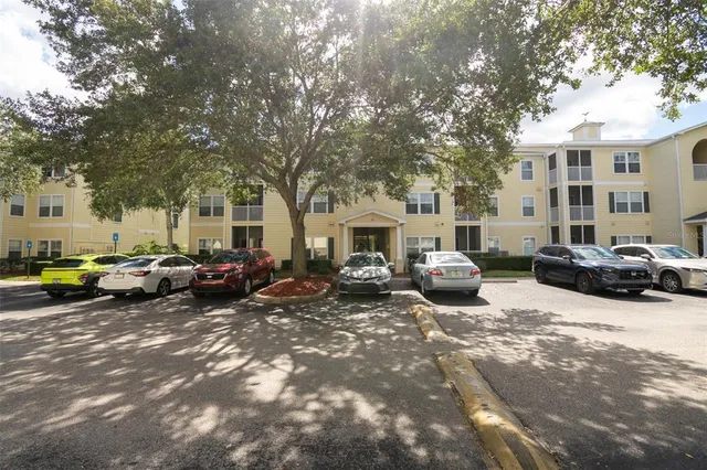 a group of cars parked in front of a house
