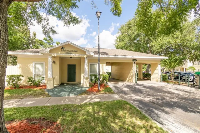 a front view of a house with a yard outdoor seating and garage