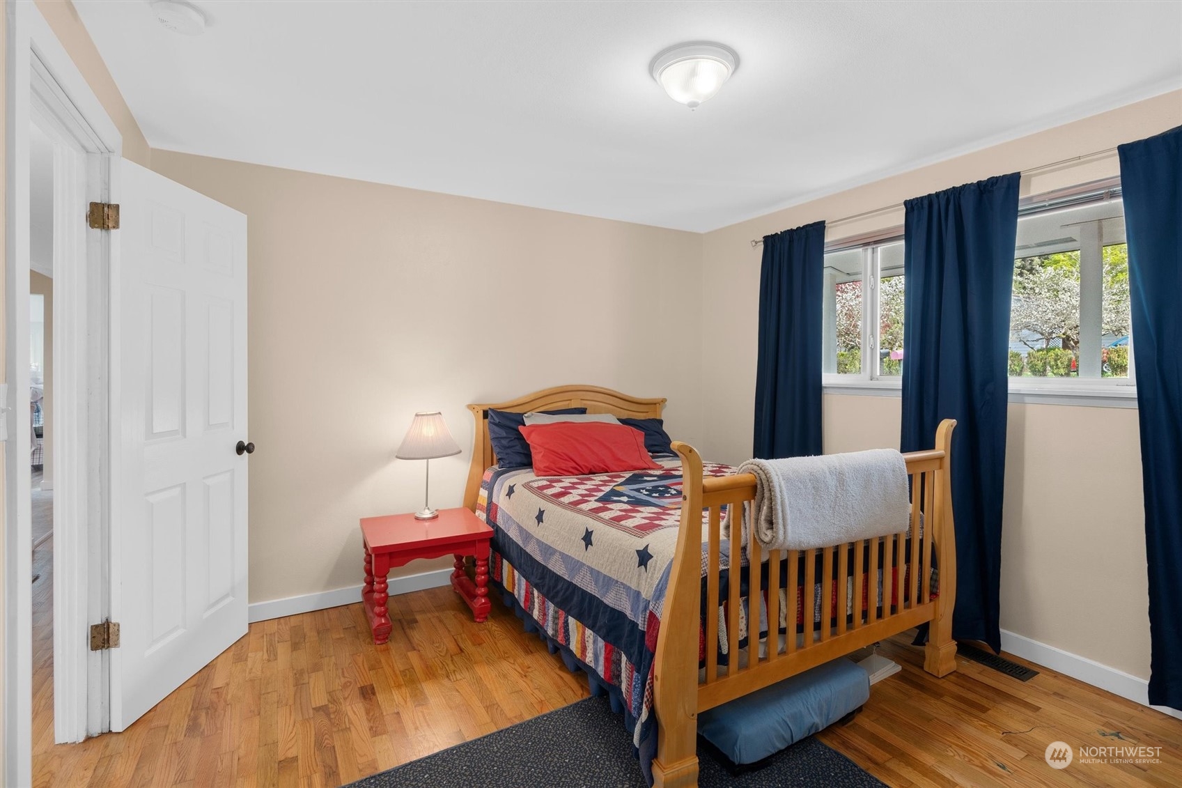 17545 Southeast 134th Street Renton, WA 98059 - Photo 18 of 40 a bedroom with a bed and a window