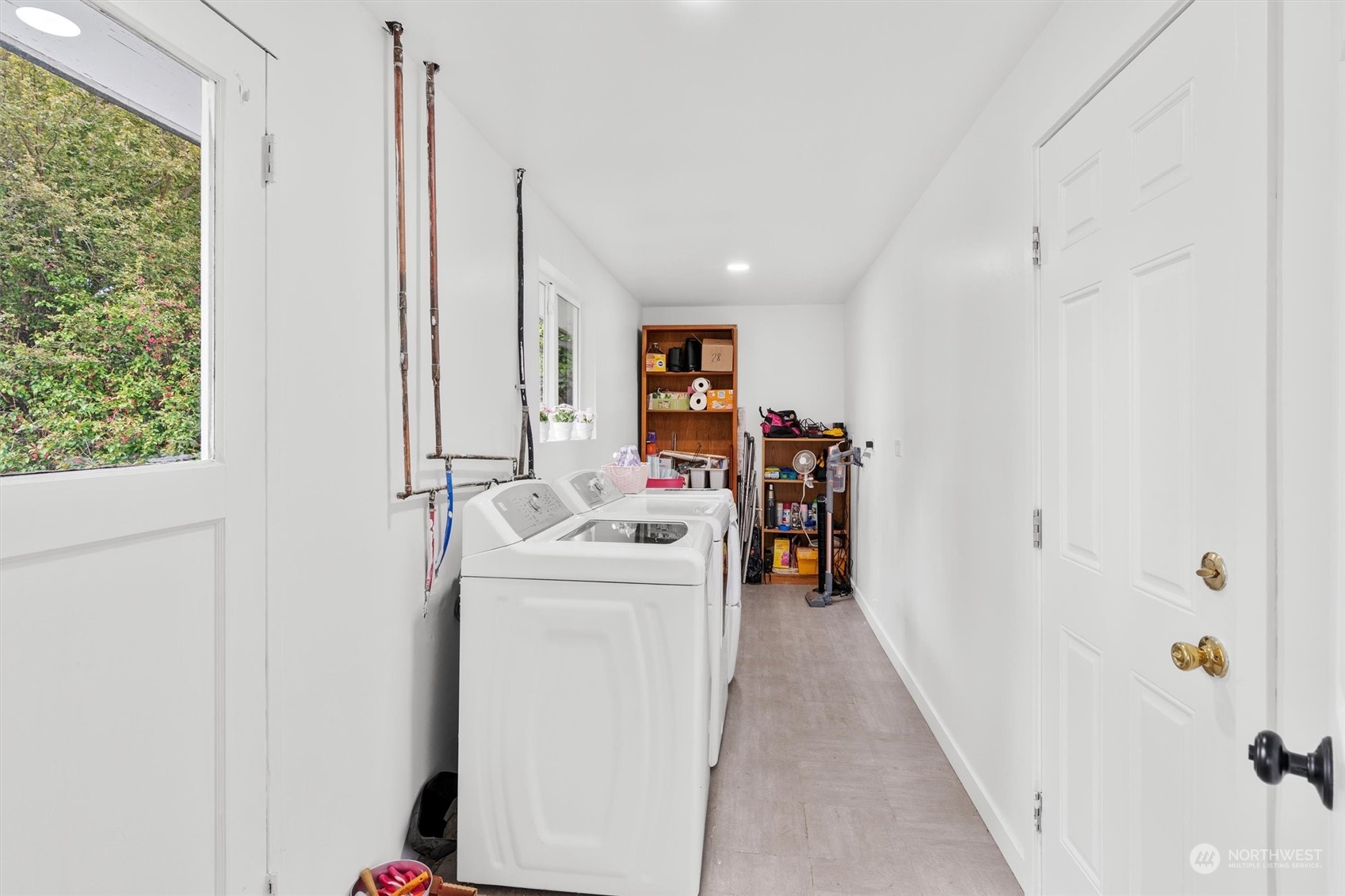 17545 Southeast 134th Street Renton, WA 98059 - Photo 23 of 40 a view of storage and utility room with washer and dryer