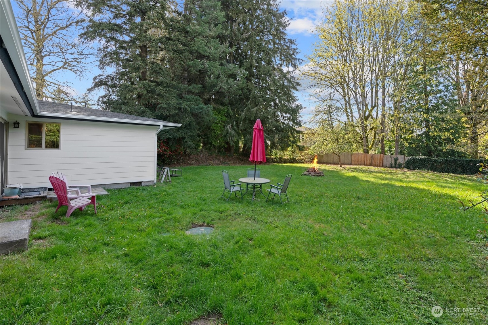 17545 Southeast 134th Street Renton, WA 98059 - Photo 25 of 40 a view of a backyard with a table and a chair