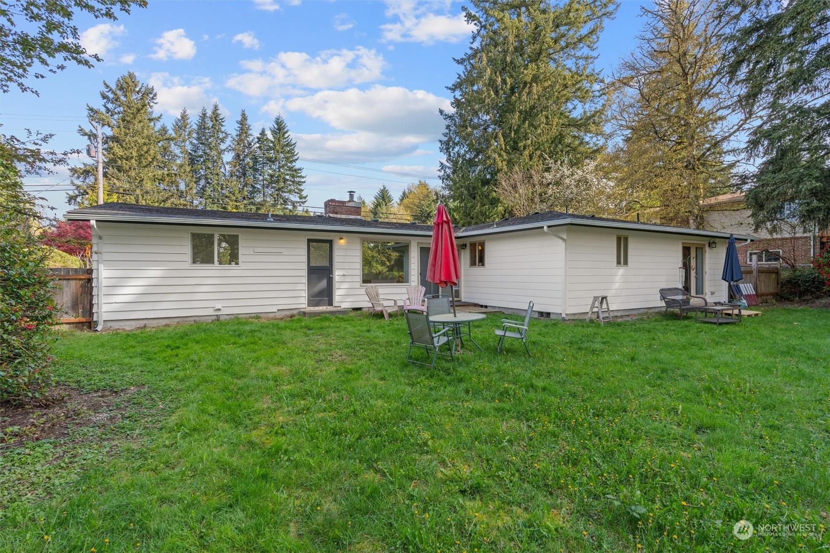 17545 Southeast 134th Street Renton, WA 98059 - Photo 26 of 40 a view of a backyard with plants and large trees