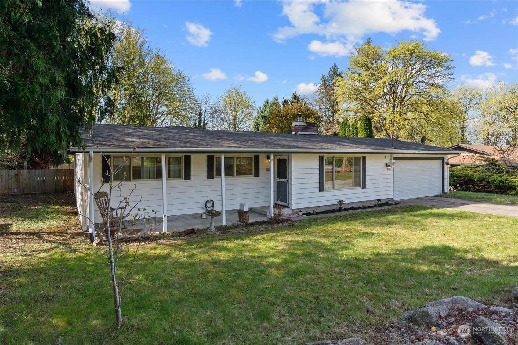 17545 Southeast 134th Street Renton, WA 98059 - Photo 31 of 40 a view of a house with a backyard and a patio