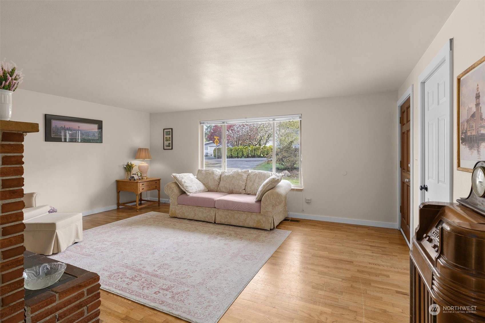 17545 Southeast 134th Street Renton, WA 98059 - Photo 5 of 40 a living room with furniture and a fireplace
