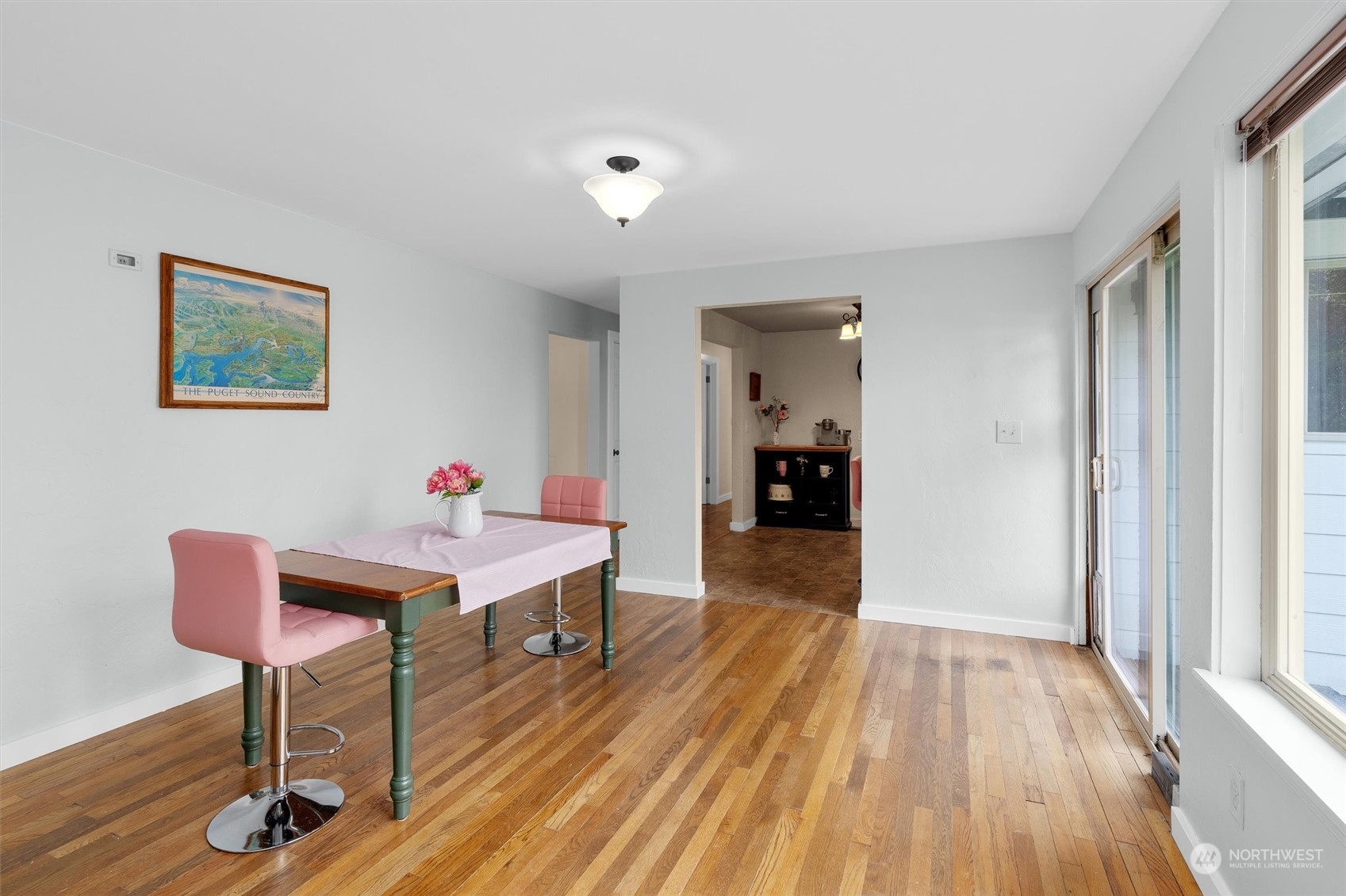17545 Southeast 134th Street Renton, WA 98059 - Photo 10 of 40 a view of a room that has a bench and a table in it