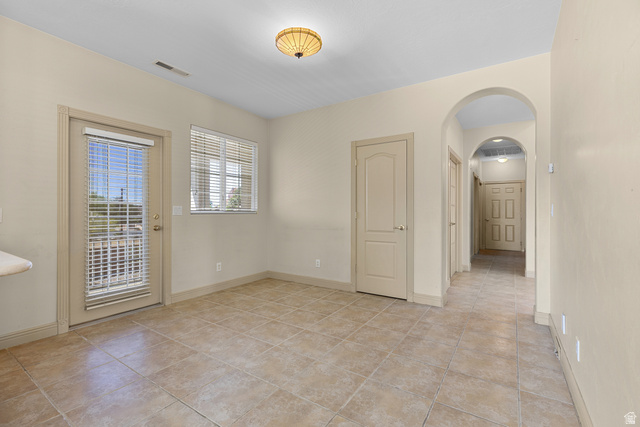 389 North Main Street St. George, UT 84770 - Photo 20 of 44 Spare room with arched walkways and light tile patterned flooring