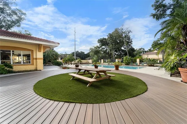 a view of a swimming pool with a patio