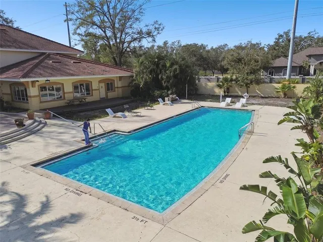 a view of a backyard with sitting area
