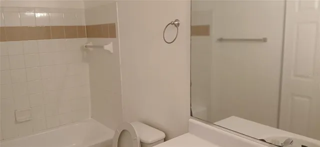 a bathroom with a shower and a toilet