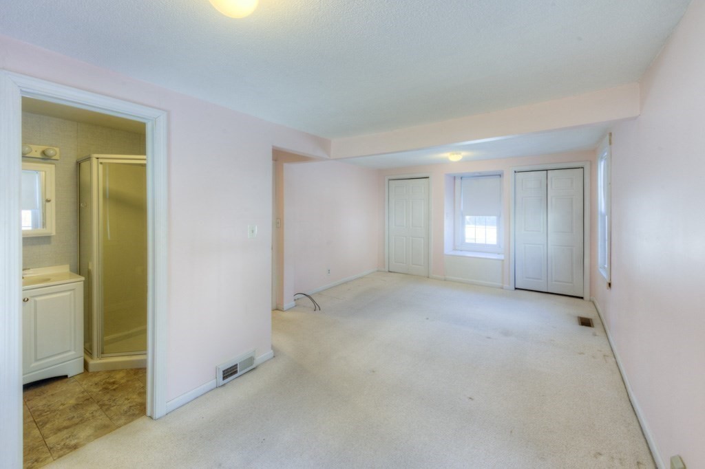 21 Marchioness Road Springfield, MA 01129 - Photo 14 of 38 an empty room with windows and closet