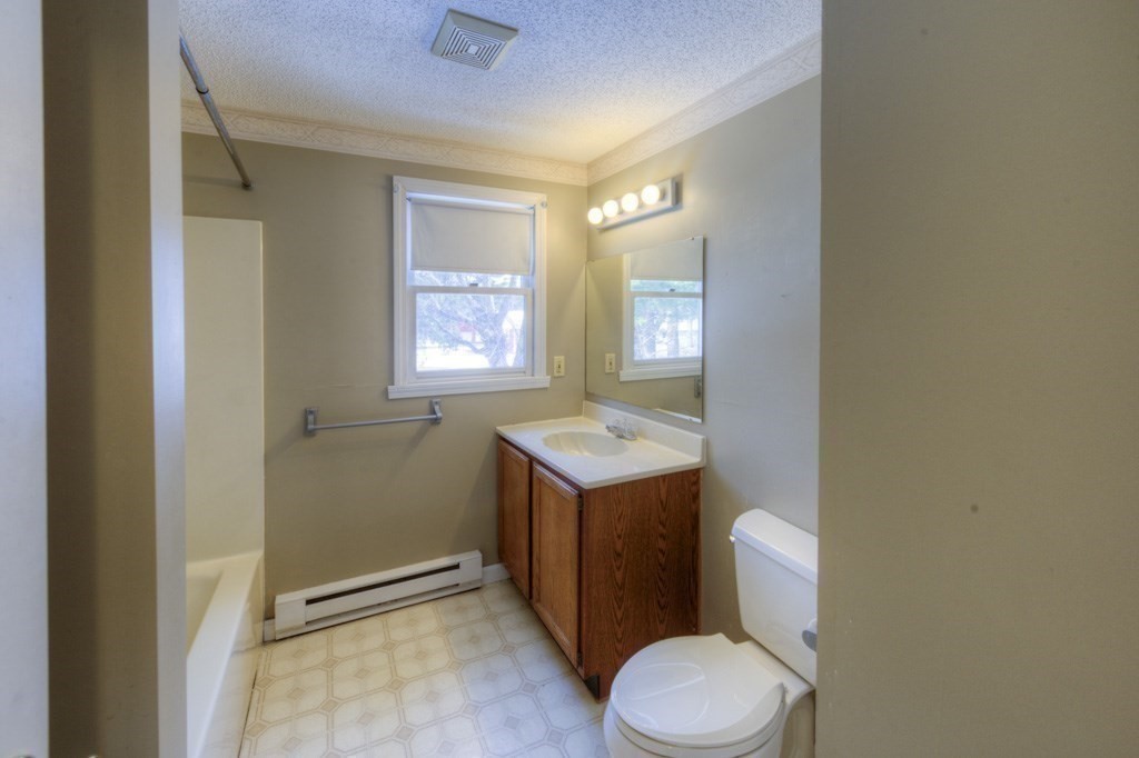 21 Marchioness Road Springfield, MA 01129 - Photo 25 of 38 a bathroom with a sink toilet vanity and window