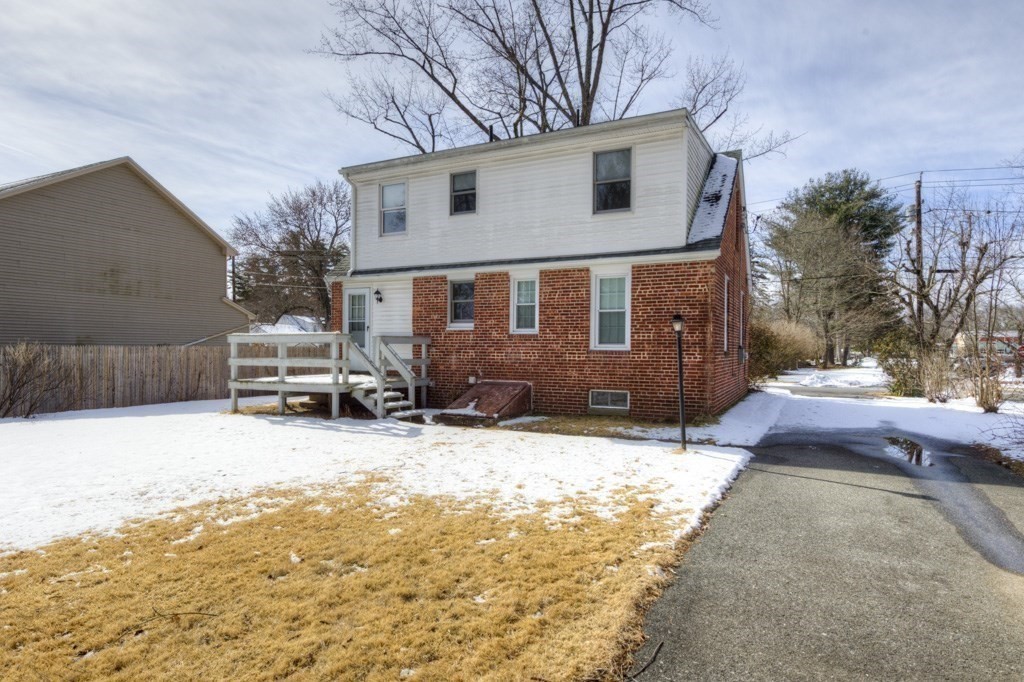 21 Marchioness Road Springfield, MA 01129 - Photo 31 of 38 a front view of a house with a yard covered in snow