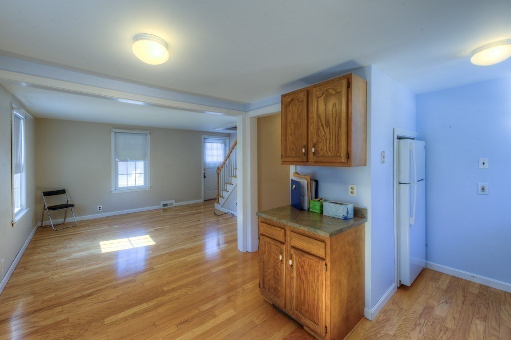 21 Marchioness Road Springfield, MA 01129 - Photo 5 of 38 a kitchen view with wooden floor and staircase