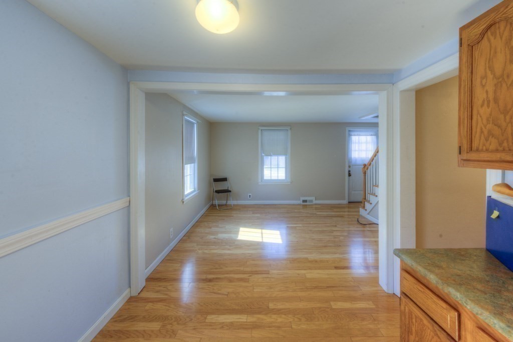 21 Marchioness Road Springfield, MA 01129 - Photo 7 of 38 a view of a hallway with wooden floor and cabinet