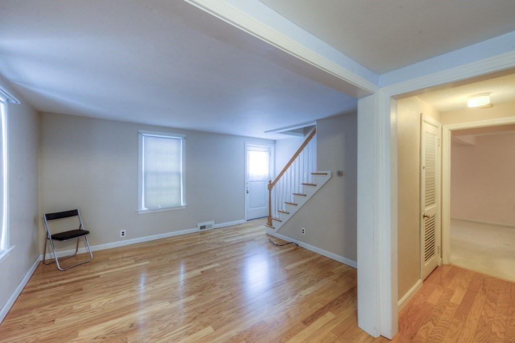 21 Marchioness Road Springfield, MA 01129 - Photo 8 of 38 a view of an empty room with wooden floor and a window