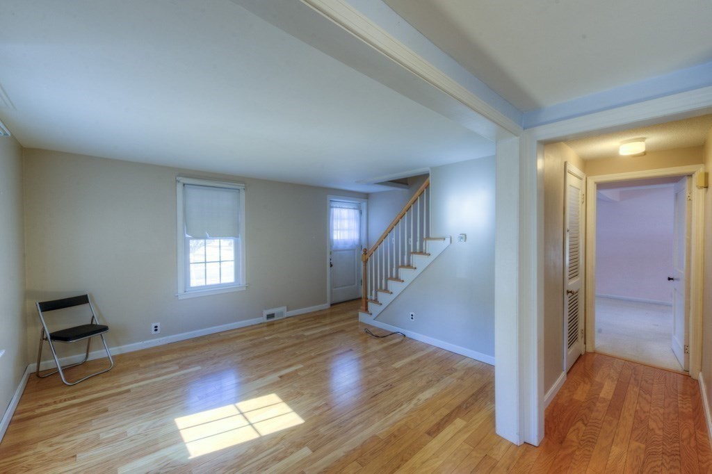 21 Marchioness Road Springfield, MA 01129 - Photo 9 of 38 a view of empty room with wooden floor and fan