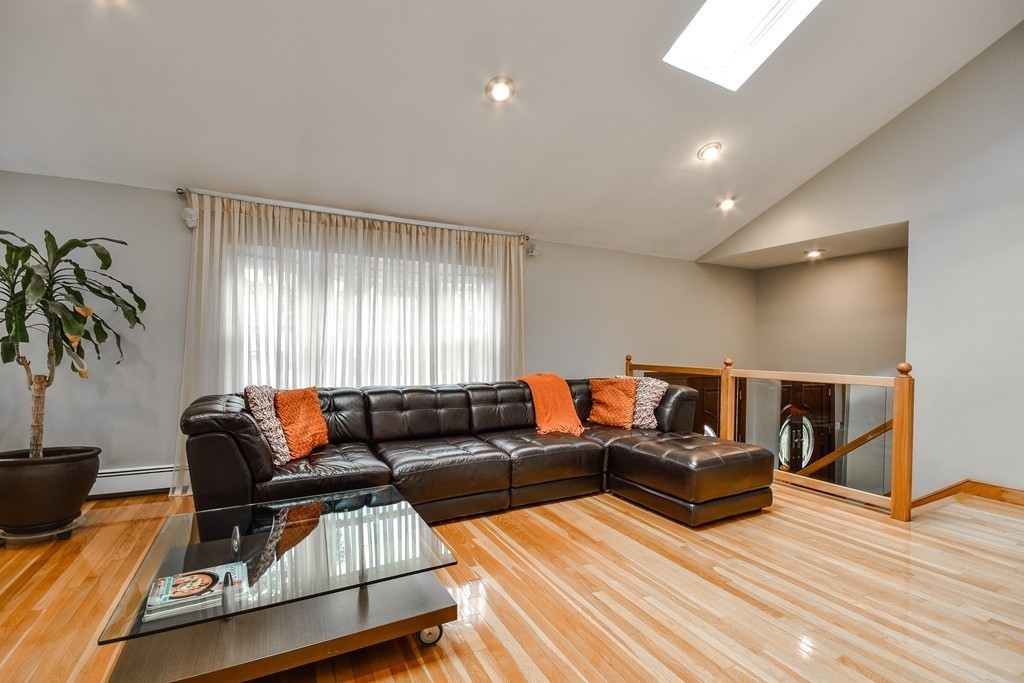 20 Rutledge Road Natick, MA 01760 - Photo 13 of 29 a living room with furniture and a flat screen tv