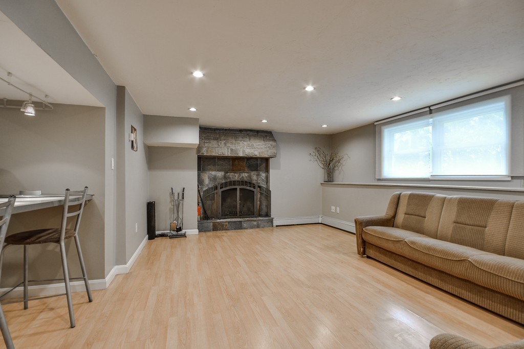 20 Rutledge Road Natick, MA 01760 - Photo 20 of 29 a view of livingroom with furniture and fireplace