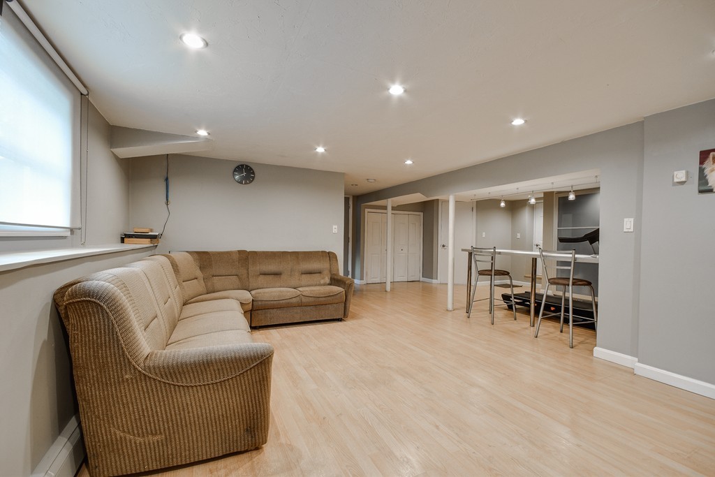 20 Rutledge Road Natick, MA 01760 - Photo 22 of 29 a living room with furniture and a table