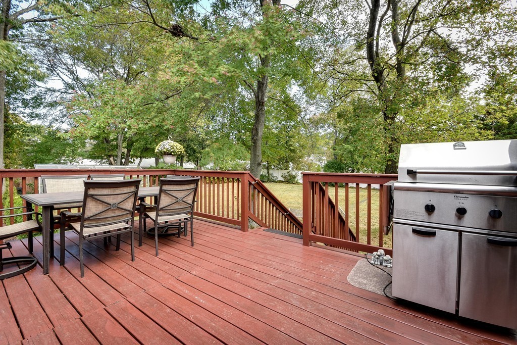20 Rutledge Road Natick, MA 01760 - Photo 27 of 29 a balcony with wooden floor table and chairs