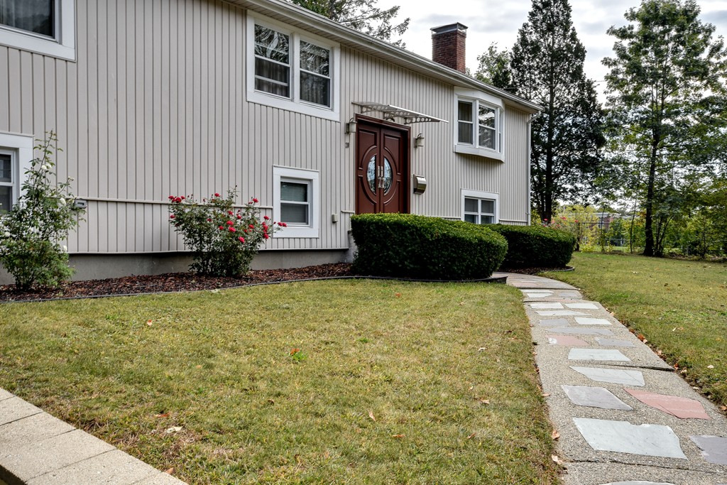 20 Rutledge Road Natick, MA 01760 - Photo 3 of 29 a front view of a house having yard