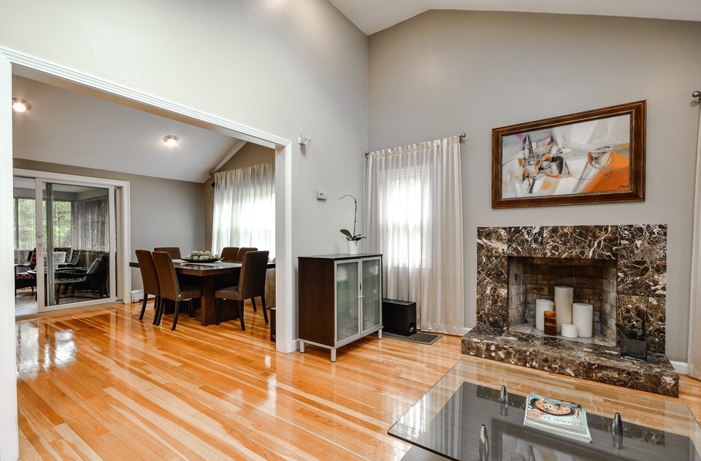 20 Rutledge Road Natick, MA 01760 - Photo 9 of 29 a view of a livingroom with furniture and a fireplace
