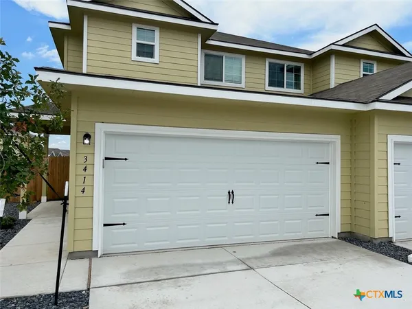 a view of a house with garage