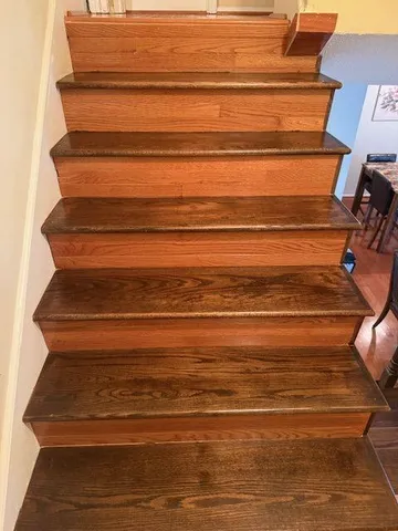 a view of a house with a yard and pathway