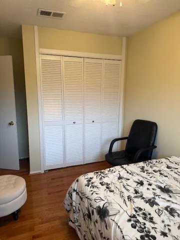 a shelf with cup and plates