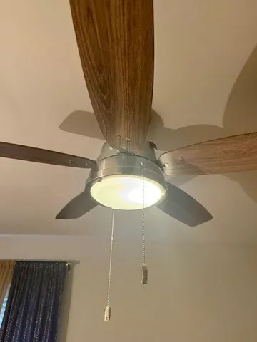 a living room with dining room and wooden floor