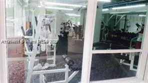 a bathroom with a glass shower door and a glass door