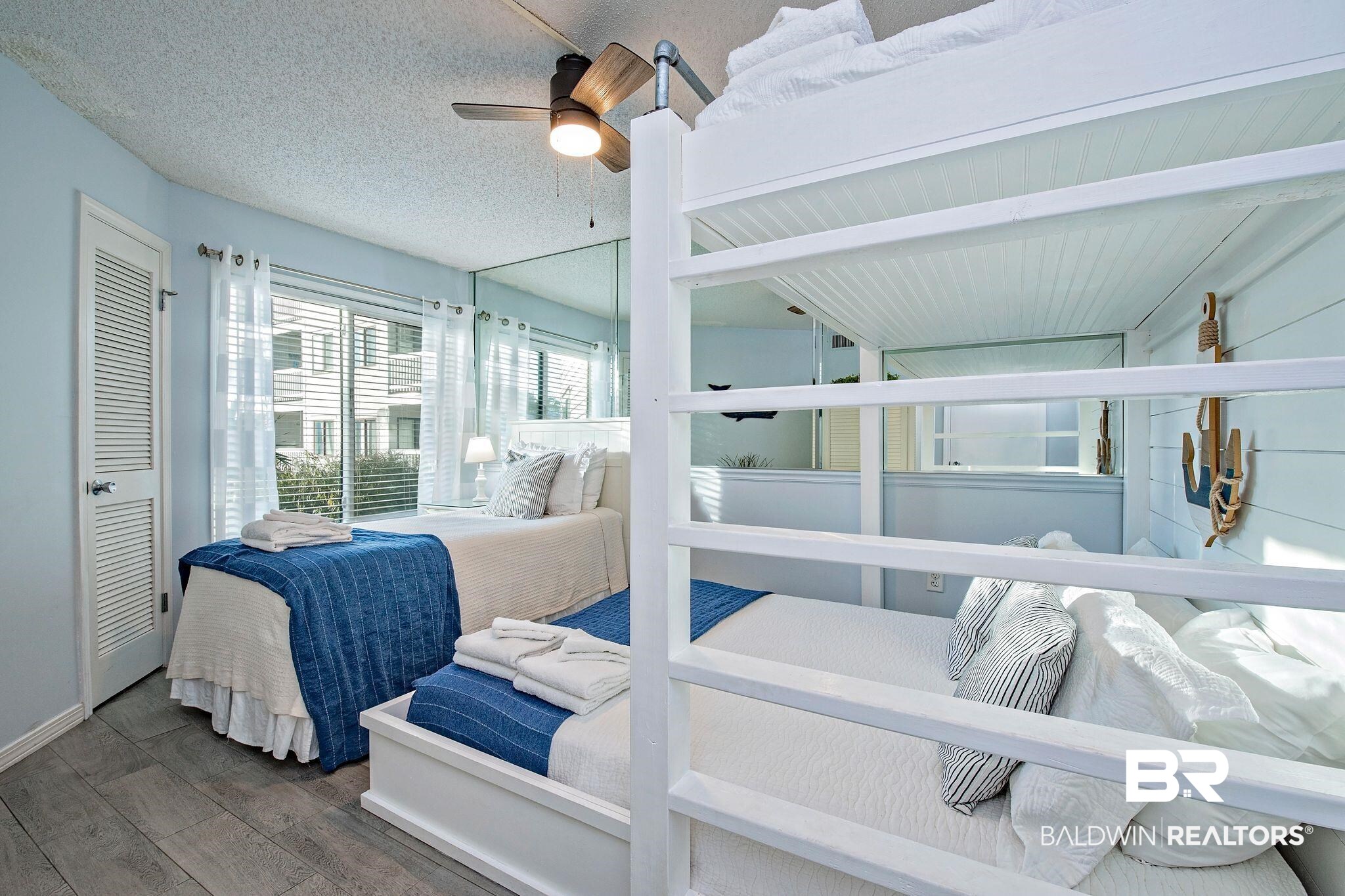 497 Plantation Road, Unit 1156 Gulf Shores, AL 36542 - Photo 15 of 28 Bedroom with ceiling fan, dark hardwood / wood-style floors, and a textured ceiling