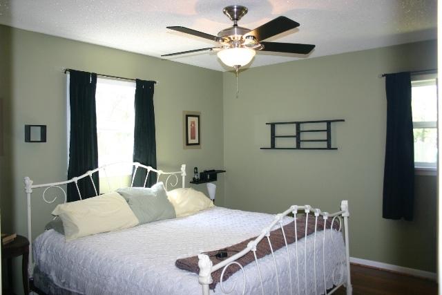 3559 Poverty Creek Road Crestview, FL 32539 - Photo 20 of 34 a bedroom with a bed and a chandelier