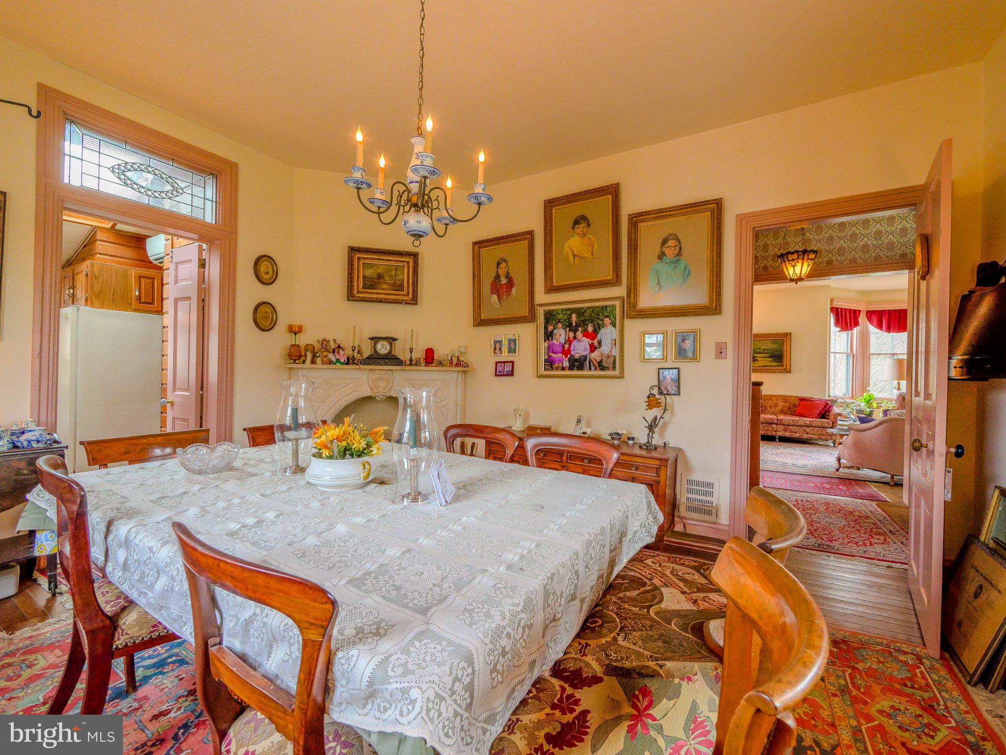 332 North Providence Road Wallingford, PA 19086 - Photo 15 of 48 a bed room with a bed and a chandelier