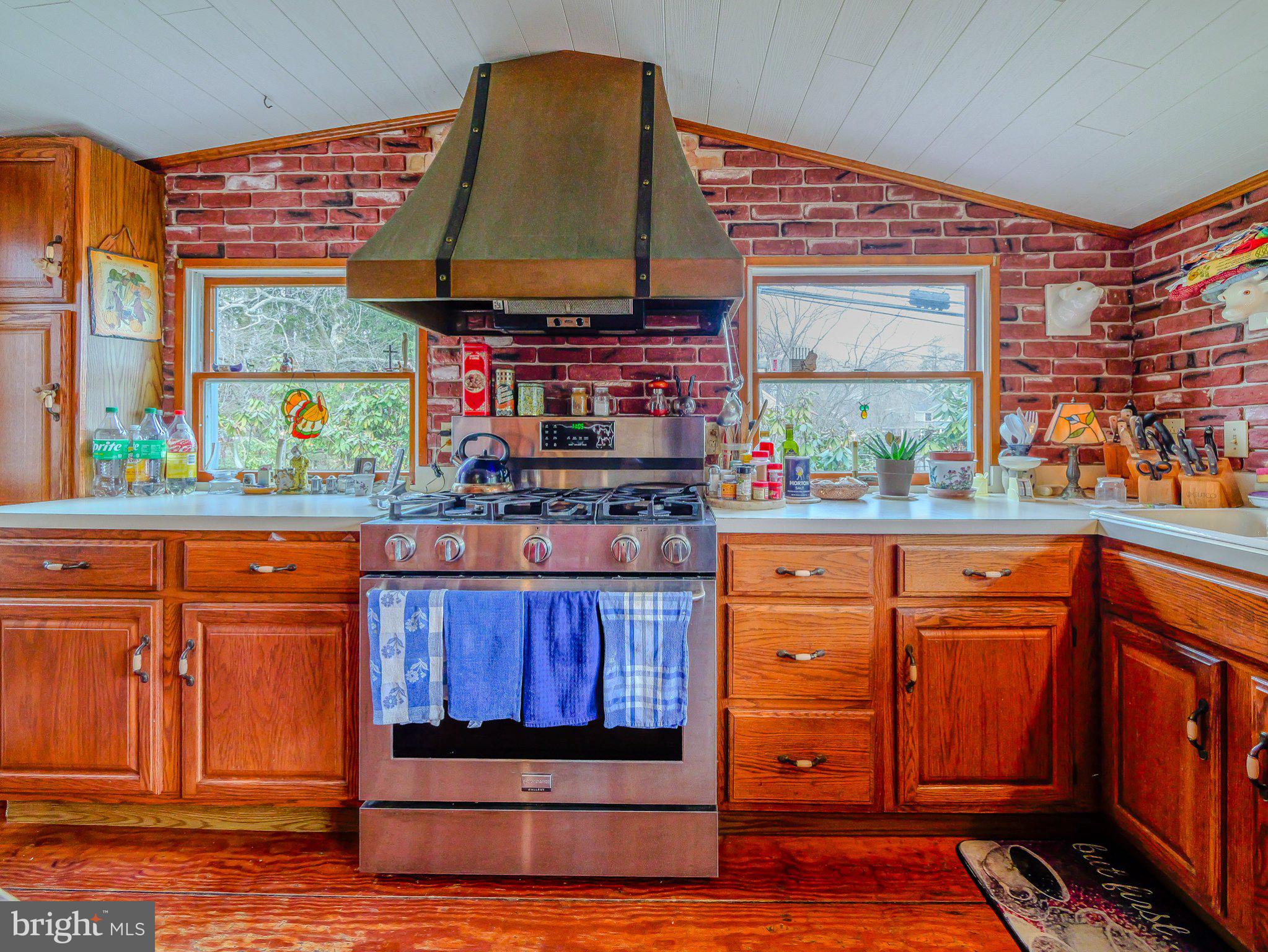 332 North Providence Road Wallingford, PA 19086 - Photo 19 of 48 a room with wooden cabinets and outdoor space