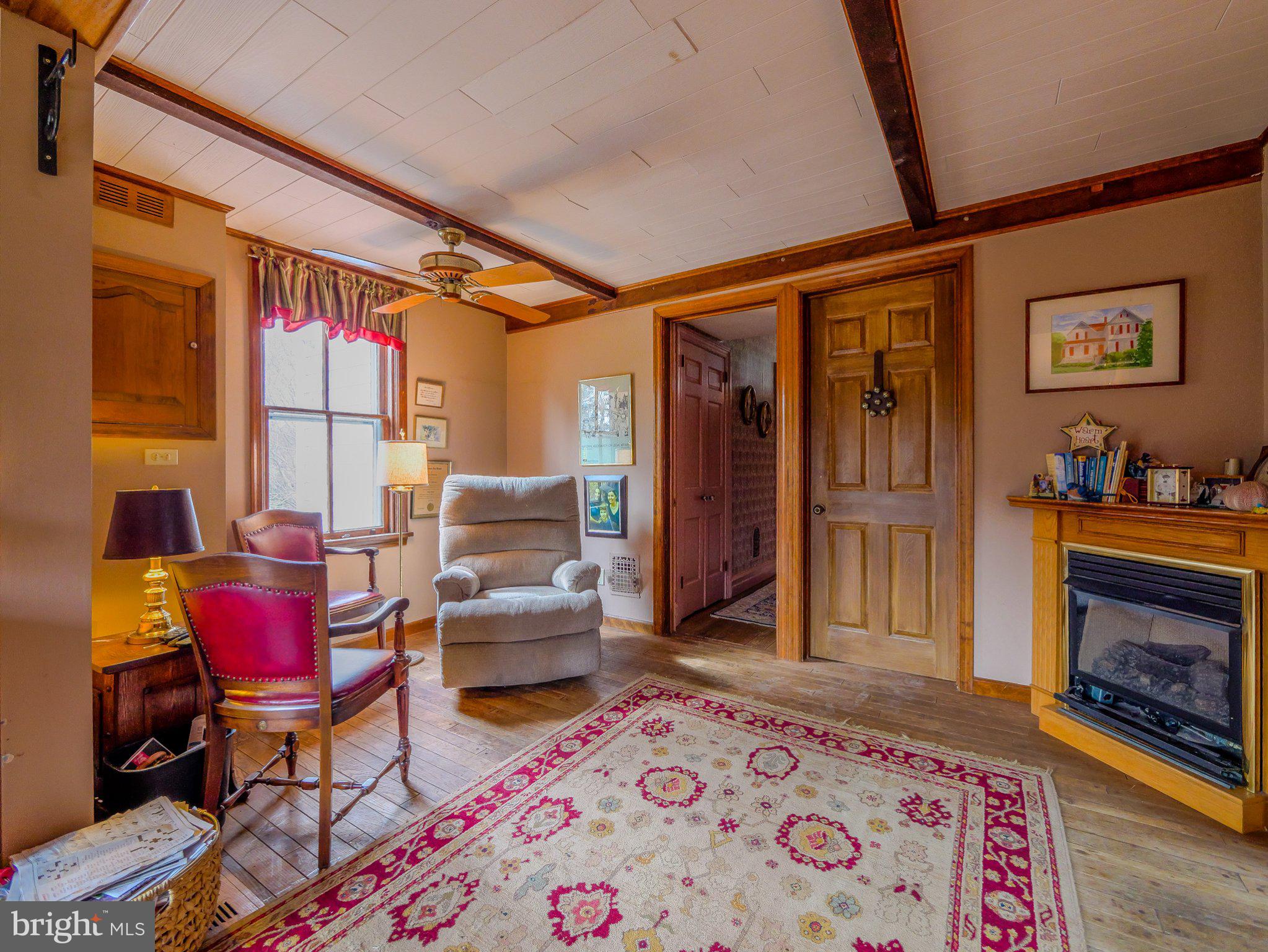 332 North Providence Road Wallingford, PA 19086 - Photo 24 of 48 a living room with furniture a rug and a fireplace
