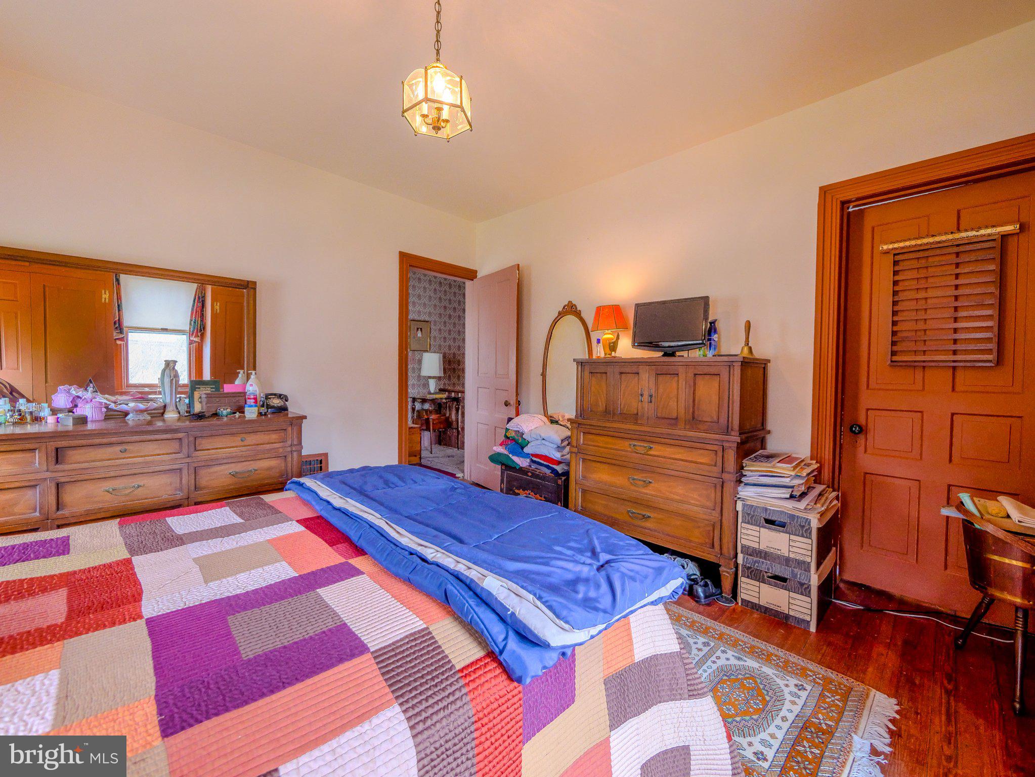332 North Providence Road Wallingford, PA 19086 - Photo 28 of 48 a bedroom with a bed and wooden floor
