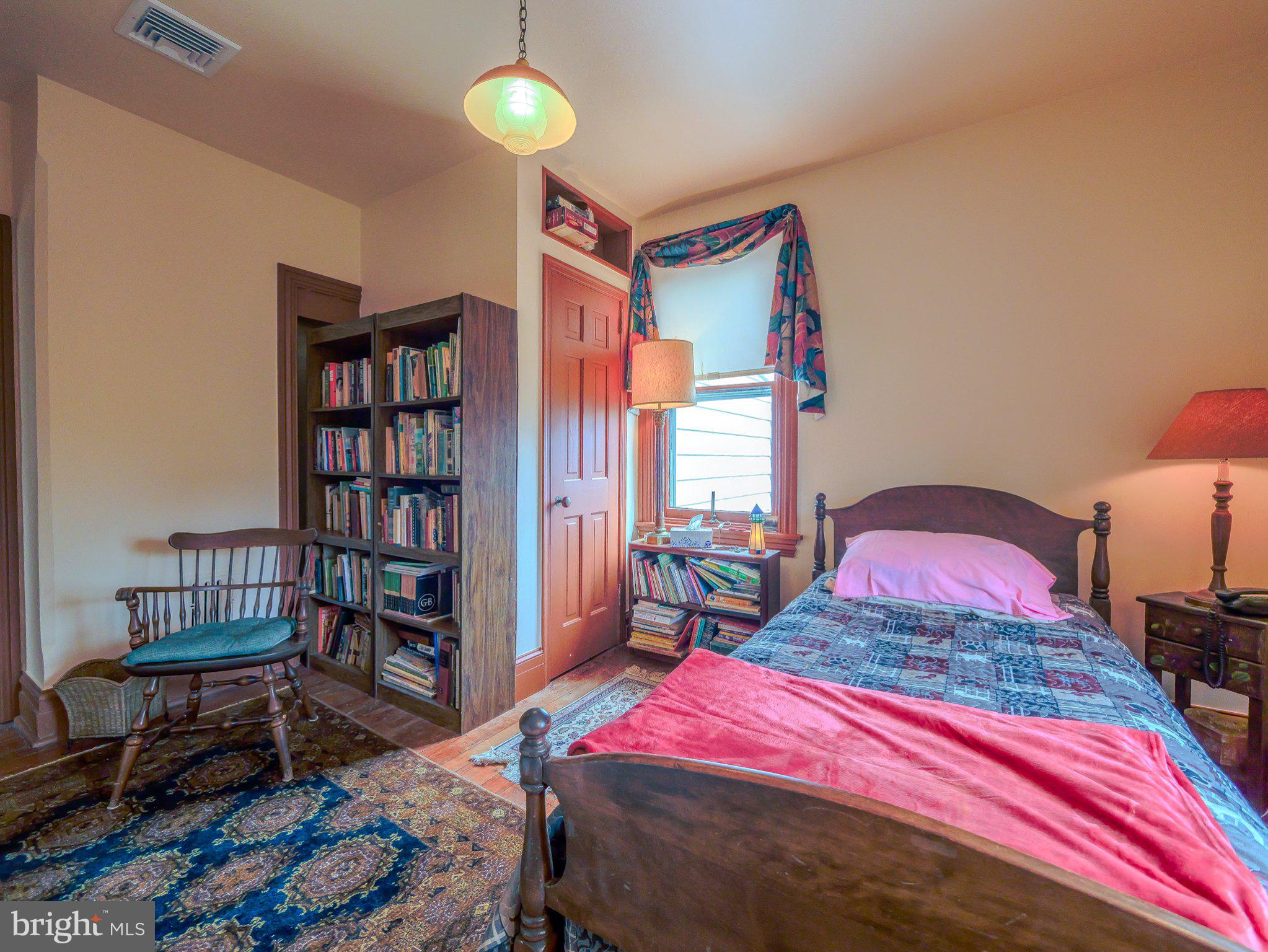 332 North Providence Road Wallingford, PA 19086 - Photo 30 of 48 a bedroom with a bed and a book shelf