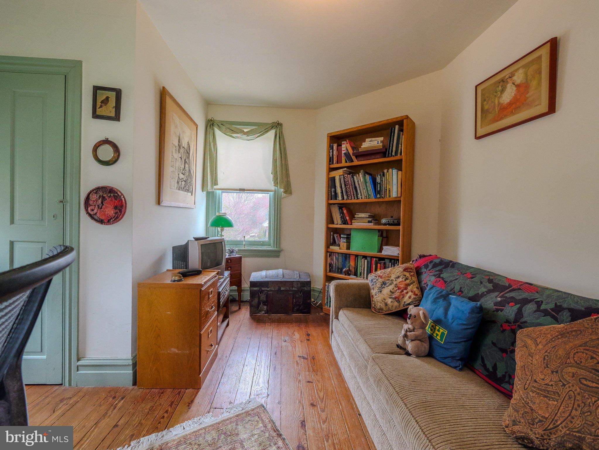 332 North Providence Road Wallingford, PA 19086 - Photo 32 of 48 a living room with furniture and bookshelf
