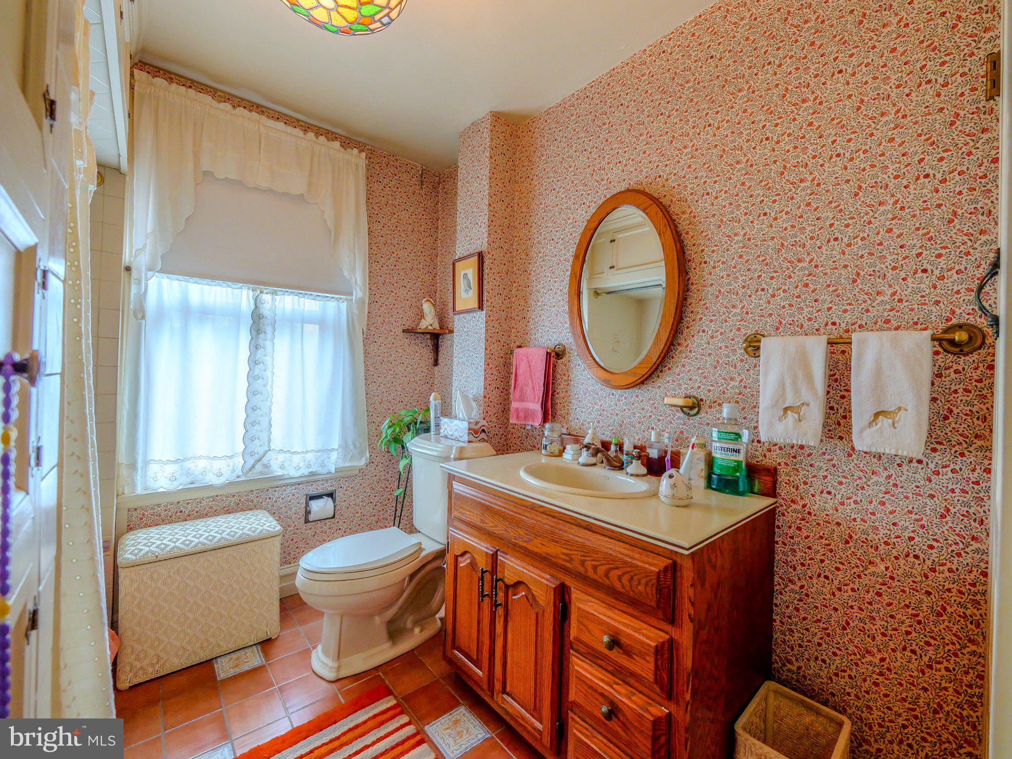 332 North Providence Road Wallingford, PA 19086 - Photo 34 of 48 a bathroom with a sink mirror vanity and a toilet