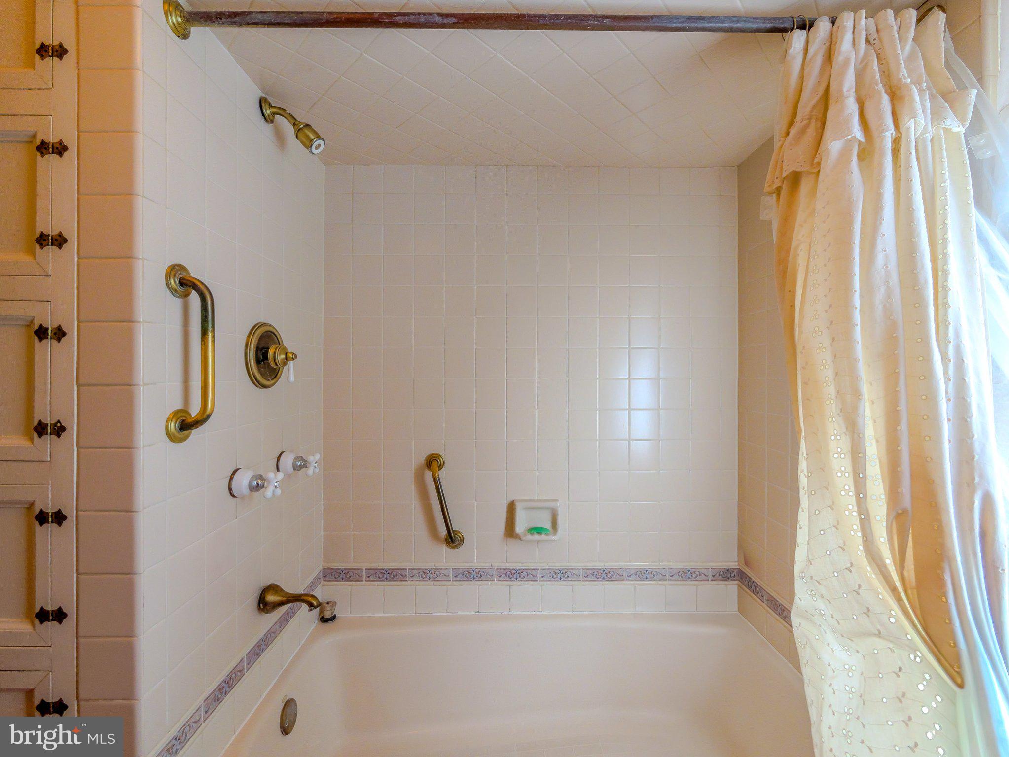 332 North Providence Road Wallingford, PA 19086 - Photo 35 of 48 a bathroom with a bathtub and shower