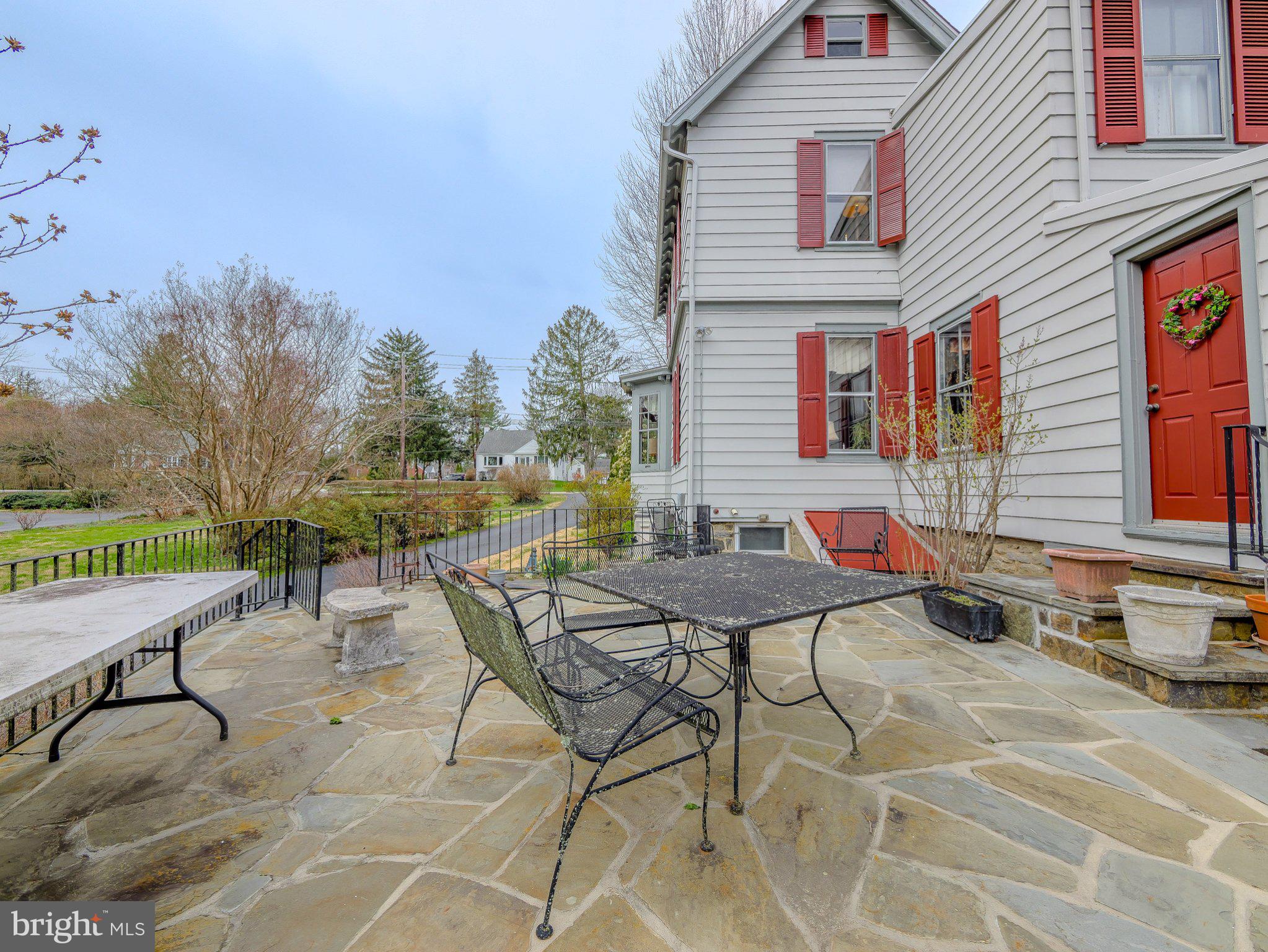 332 North Providence Road Wallingford, PA 19086 - Photo 44 of 48 a view of a patio with table and chairs and potted plants