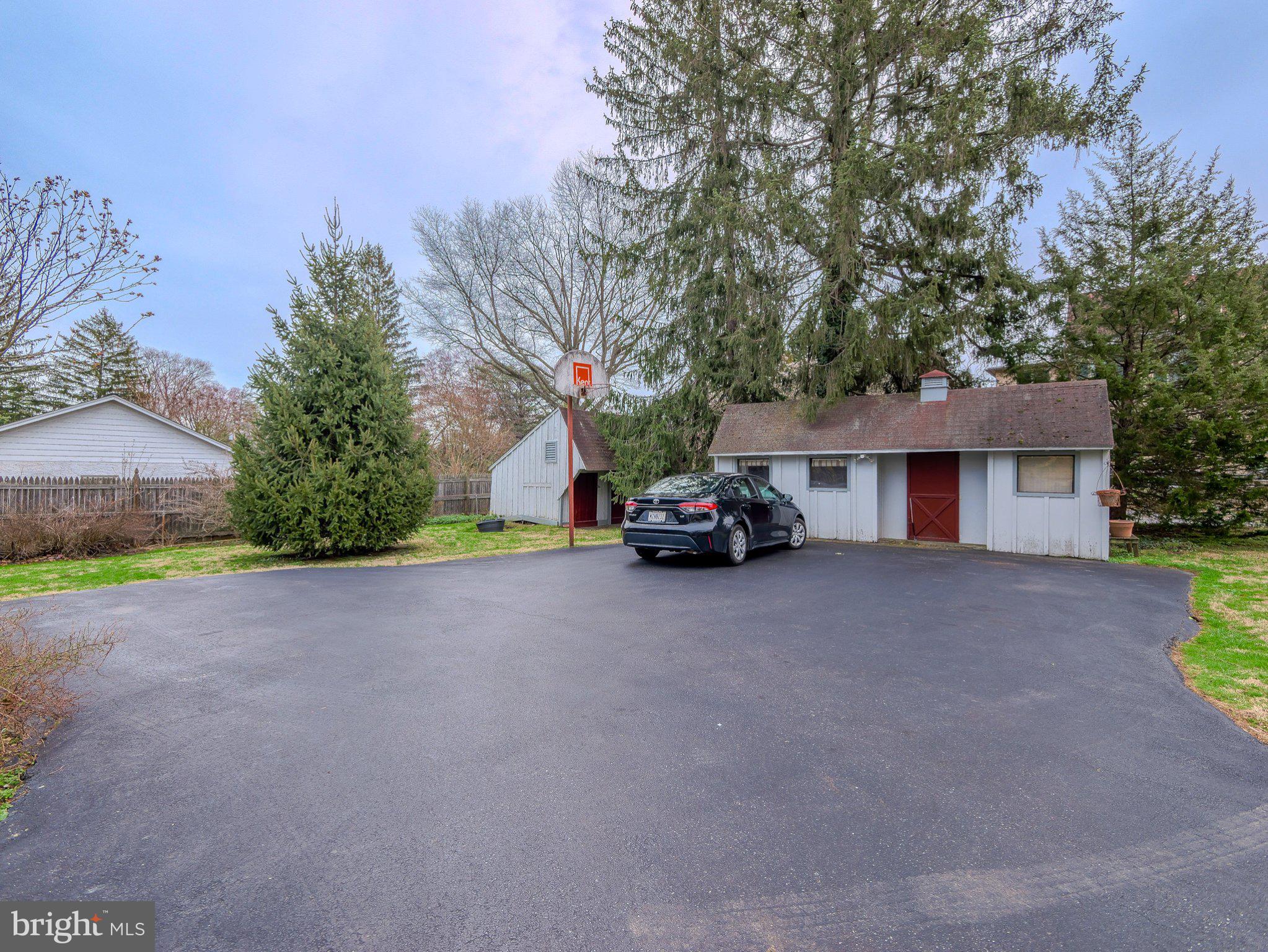 332 North Providence Road Wallingford, PA 19086 - Photo 48 of 48 a car parked in front of house with a yard