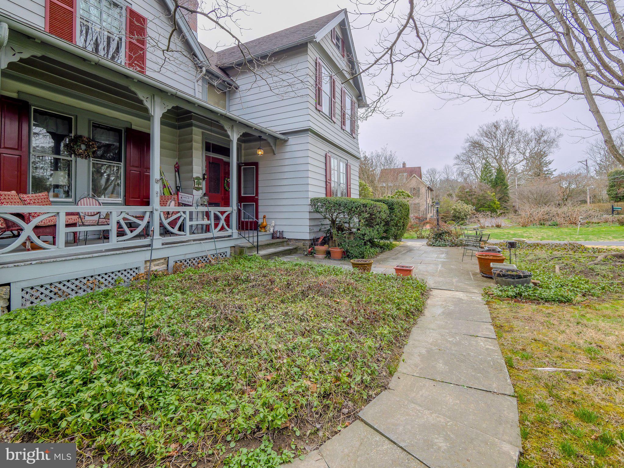 332 North Providence Road Wallingford, PA 19086 - Photo 5 of 48 a view of a chairs and table in the patio of the house