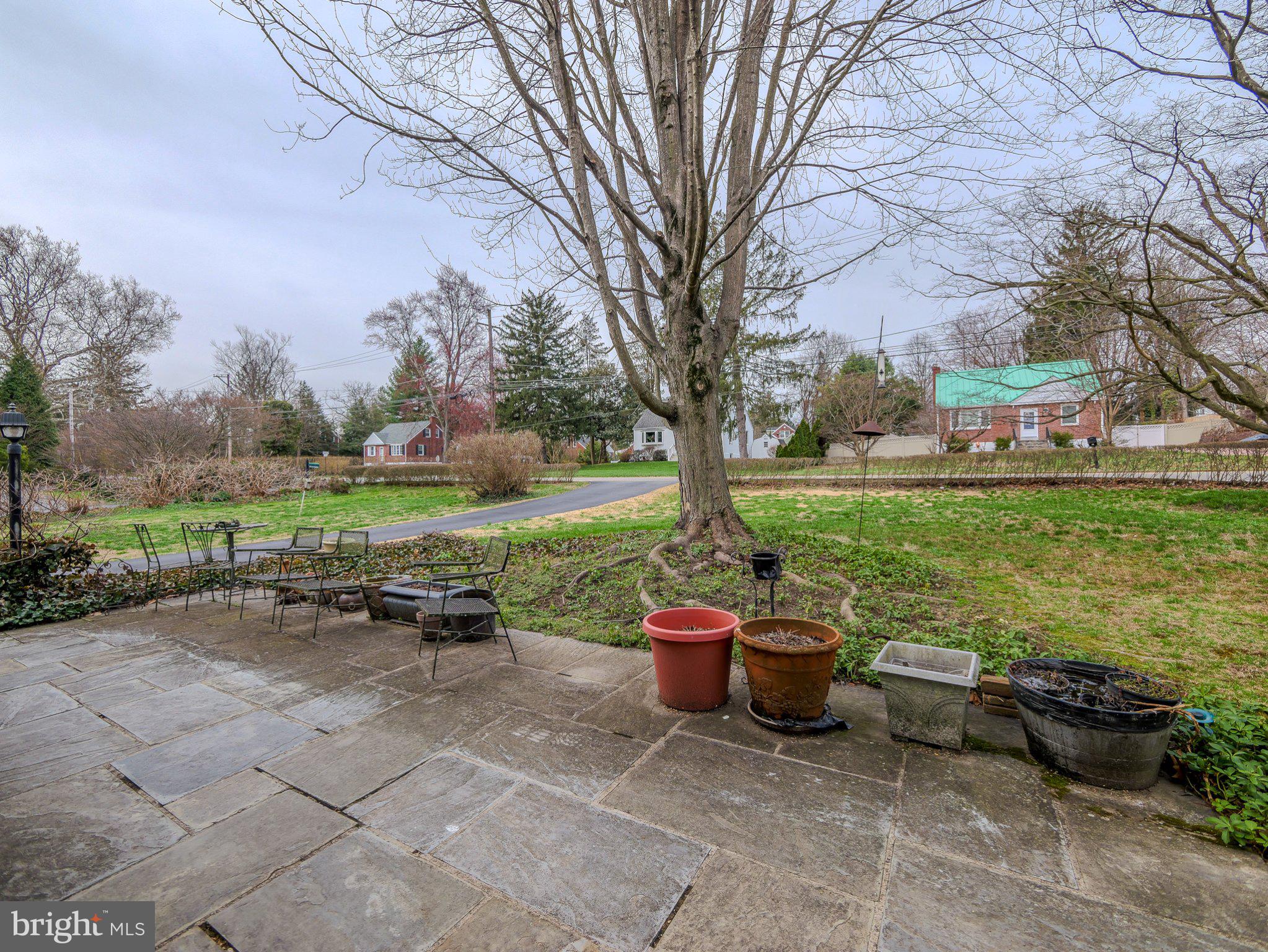 332 North Providence Road Wallingford, PA 19086 - Photo 6 of 48 a view of a patio with garden and plants
