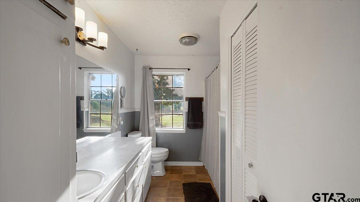 8192 County Road 428 Tyler, TX 75704 - Photo 20 of 38 a living room with furniture and a large window